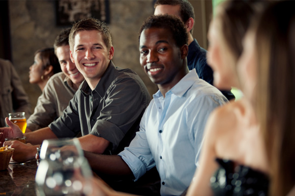 woman-flirting-with-group-of-men-at-bar